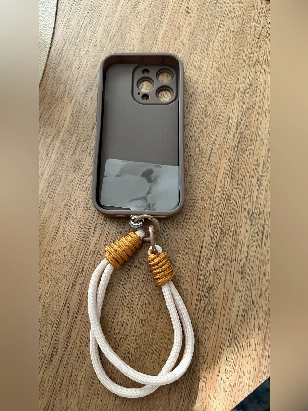 Brown Phone Case with Gold Heart Accent and creme/Gold Wrist Strap iPhone 14pro